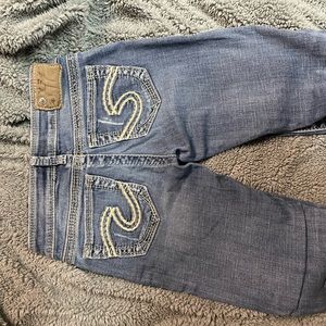 Silver skinny jeans.